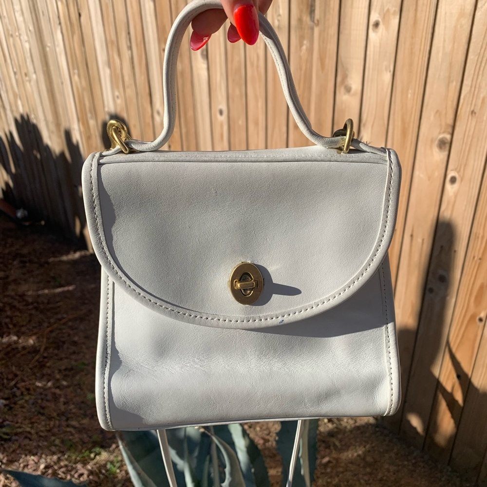 Vintage COACH white leather turnlock crossbody “Regina”